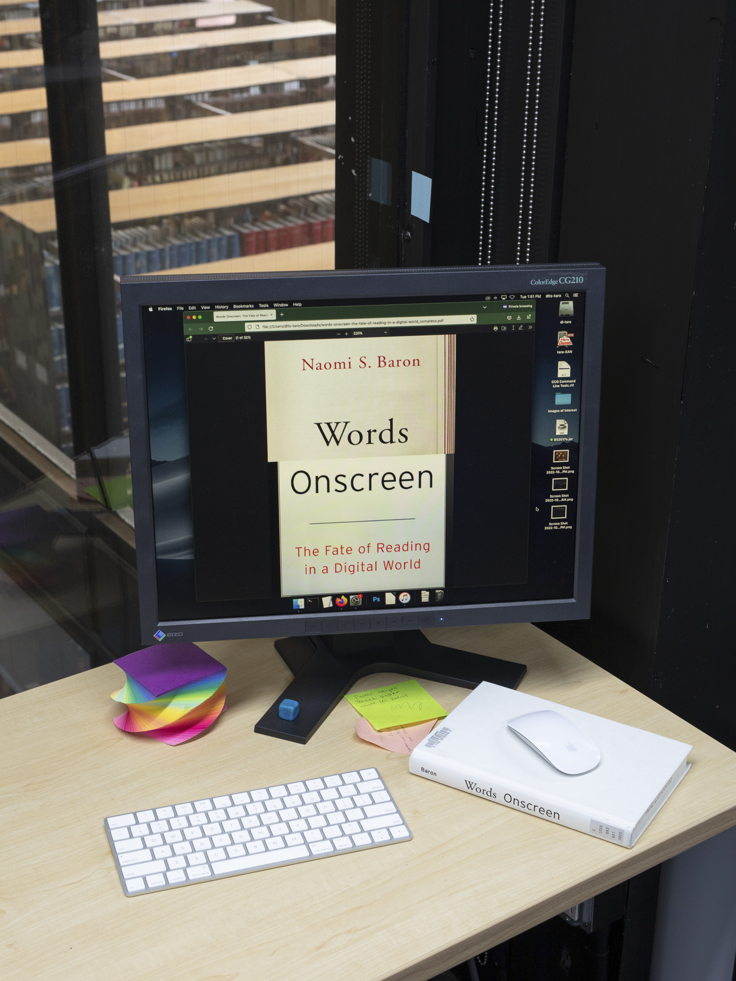 Words displayed on a computer screen which is resting on a desk